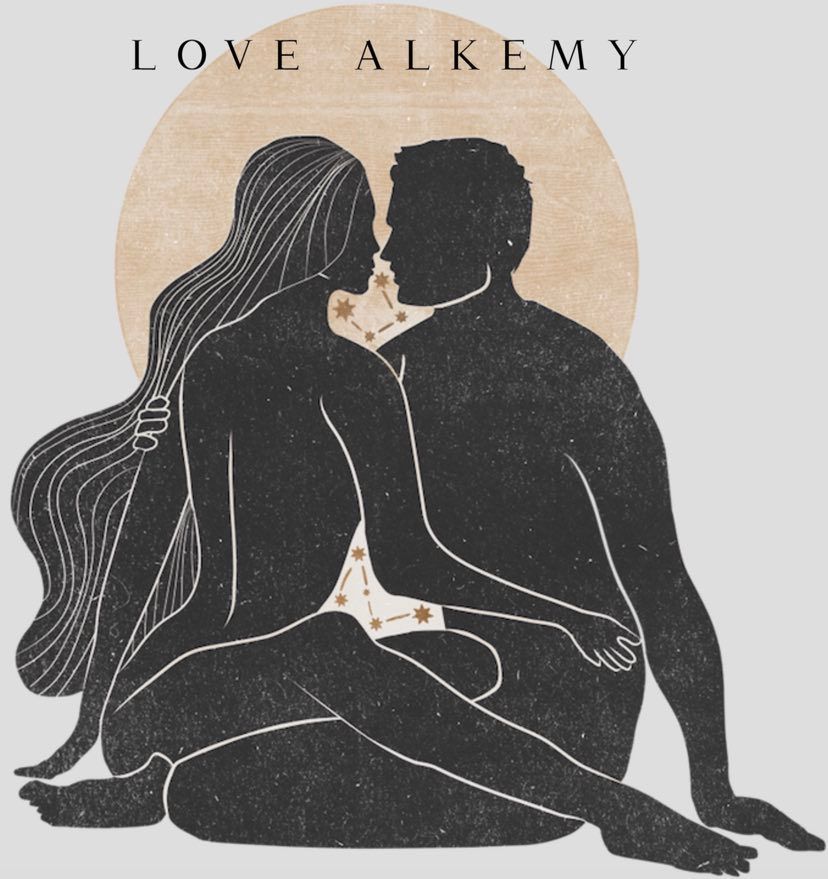 This is a hand crafted lino print image of a man and a woman sitting on the ground in an embrace. The background is cream and the man and woman are black. the woman has long flowing hair down past her waist.in the background behind them is a large golden Sun. the love alkemy logo sits above their head.